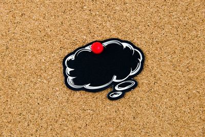 Close-up of heart shape on sand