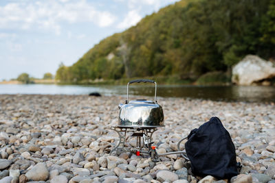 View of pebbles on rock by river