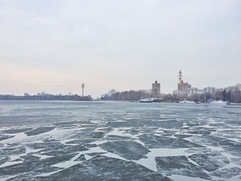 Scenic view of frozen lake against sky