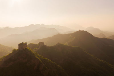 View of the great wall and mountains at sunrise