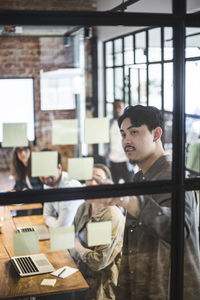 Businessman explaining colleagues during meeting at startup company