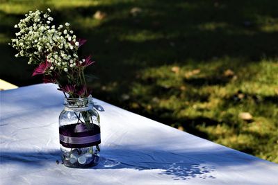 Close-up of flower vase on table