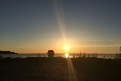 Scenic view of sea at sunset