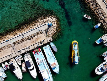 High angle view of boats moored on sea shore