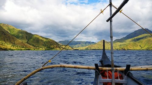 Ship sailing on sea against sky