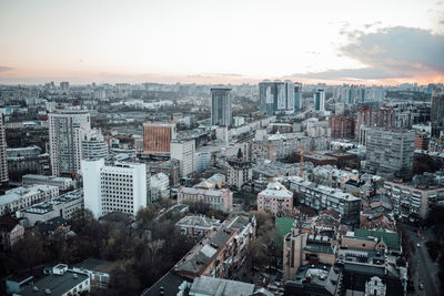 High angle view of modern buildings in city against sky