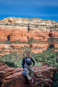 Man sitting on rock