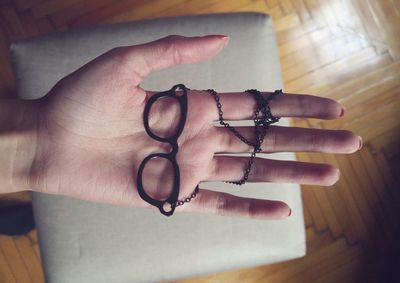 Close-up of woman's hand on mirror