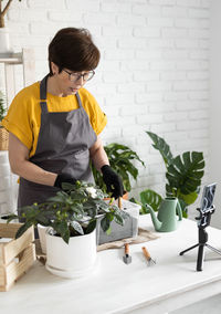 Side view of boy preparing food at home