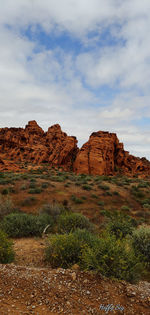 Rock formations on landscape against sky