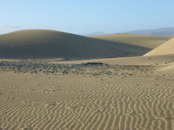 Scenic view of desert against clear sky