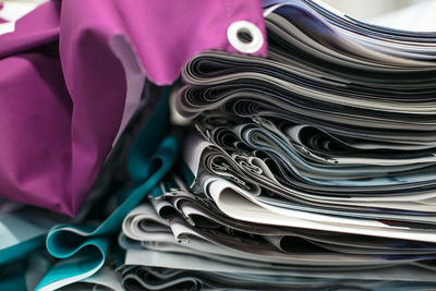 Close-up of stacked fabrics arranged