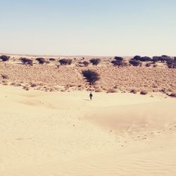 Scenic view of desert against clear sky