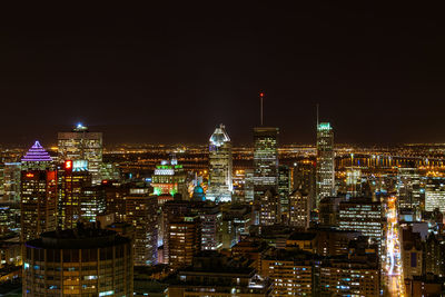 Illuminated buildings in city at night