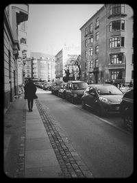 Woman walking on city street