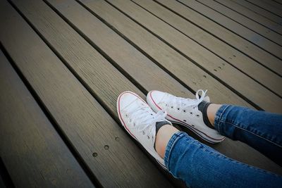 Low section of woman on boardwalk