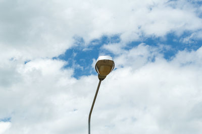 Low angle view of street light against sky