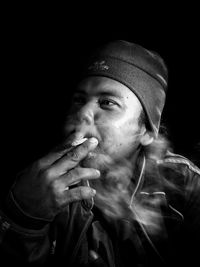 Portrait of man smoking cigarette