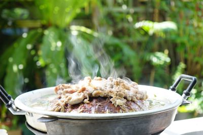 Close-up of meat in bowl on table
