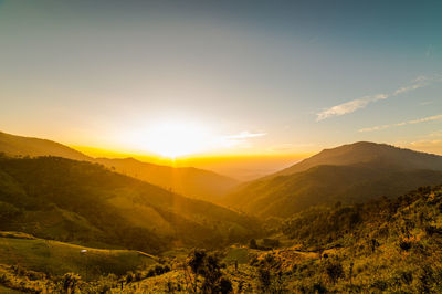 Scenic view of mountains against sky during sunset