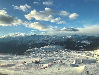 Scenic view of snowcapped mountains against sky