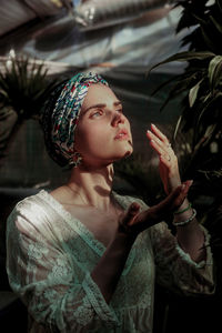 Young woman looking away outdoors