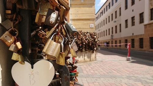 Close-up of padlocks hanging on street