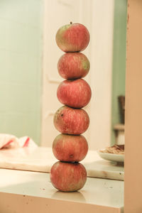 Stack of apples on kitchen counter