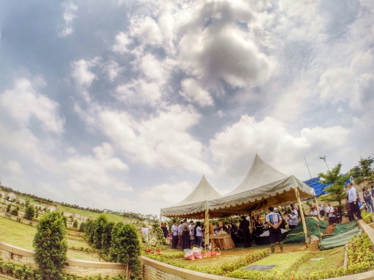 sky, large group of people, cloud - sky, tree, person, cloudy, cloud, lifestyles, built structure, architecture, leisure activity, men, day, building exterior, mixed age range, vacations, outdoors, nature, travel