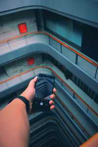 High angle view of person photographing camera
