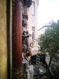 View of statue by building