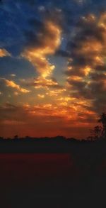 Scenic view of dramatic sky during sunset