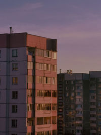 Low angle view of buildings against sky during sunset