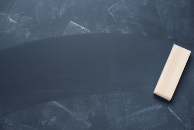 Close-up of duster on blackboard