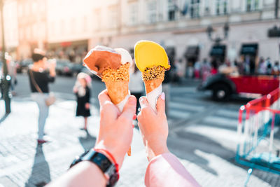 Midsection of ice cream on street