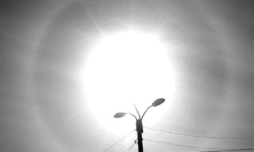 Low angle view of street light against sky