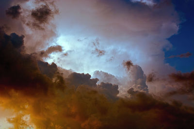 Low angle view of dramatic sky during sunset