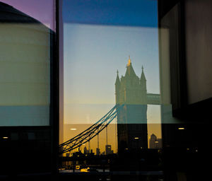 Reflection of tower bridge on glass window