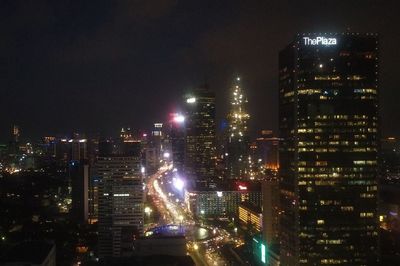 Illuminated buildings in city at night