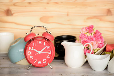 Close-up of clock on table