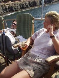 Young couple sitting on boat