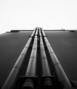 Low angle view of smoke stack against sky