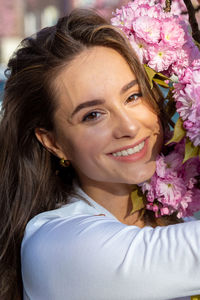 Close-up portrait of a smiling young woman