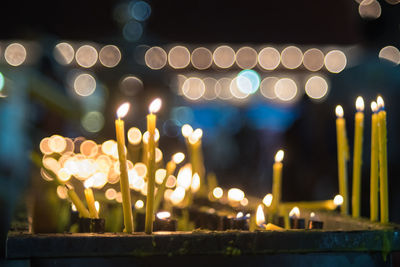 Defocused image of illuminated candles