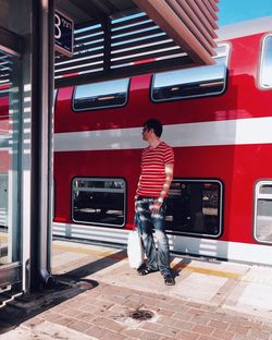 Full length of man at railroad station