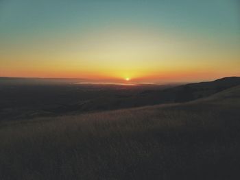 Scenic view of landscape at sunset