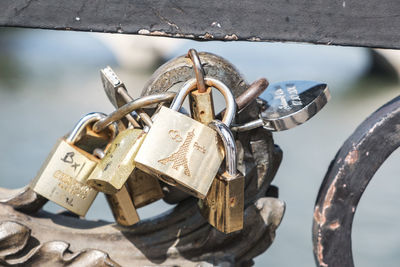 Close-up of padlocks hanging on metal