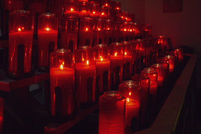 Illuminated candles in temple