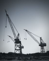 Low angle view of crane at construction site