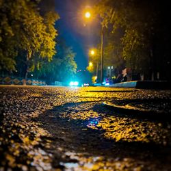 View of illuminated street at night